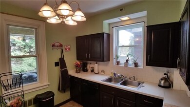 Dual sink & plenty of counter top space, tiled bac