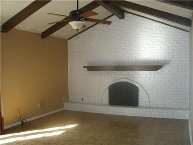 Enjoy the spacious den w/ fireplace, beamed ceilin
