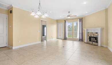 Living room with fireplace overlooking patio.