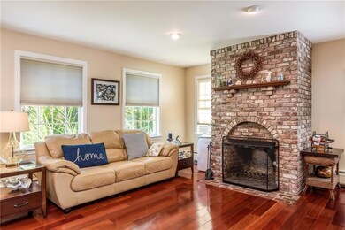 Beautiful fireplace and hardwood...