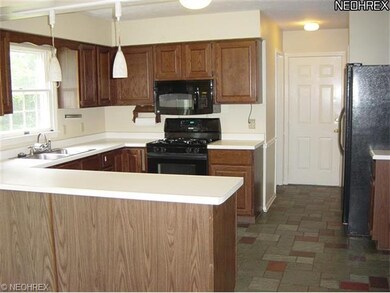 An abundance of Kitchen Cabinetry and plenty of wo