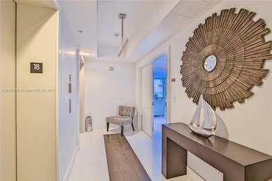 PRIVATE ELEVATOR ENTRANCE TO FOYER AND DOUBLE DOOR