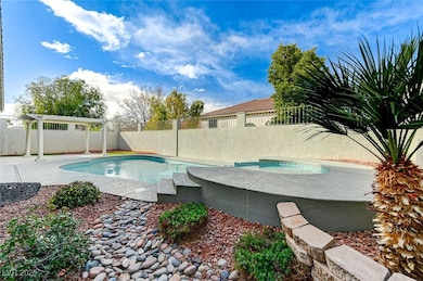 View of swimming pool featuring a fenced backyard,