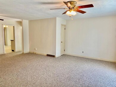 View from the front door. Natural light enters the dining room from the side entrance of the home as well as from the kitchen.