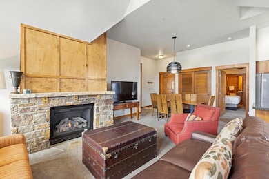 Living room featuring light colored carpet and a s