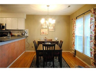 Dining Room with Hardwood Floors.