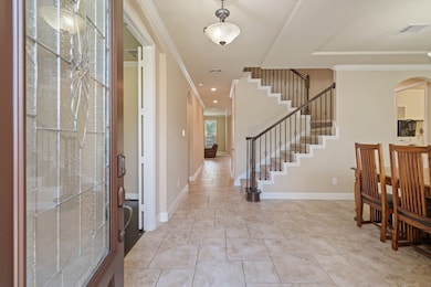 Upon entry, you're greeted by a spacious living ar