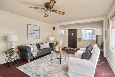 View from kitchen back to the main entry of the home.