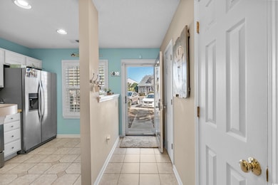 Interior space featuring stainless steel fridge wi