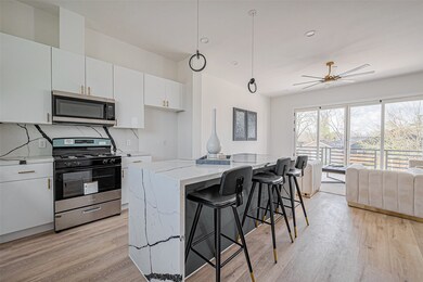 This modern kitchen seamlessly flows into the fami