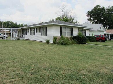 Exterior Front. View from corner showing garage an