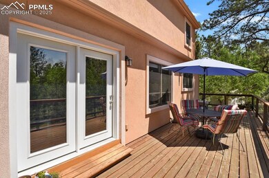 Deck with french doors and outdoor dining space