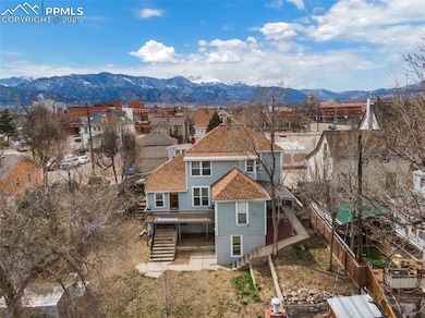 Aerial view featuring a mountain view and a reside