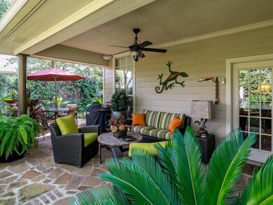COVERED PATIO WITH EXTENDED FLAGSTONE FOR A LARGE 