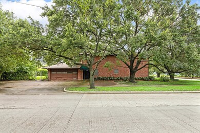 The property is surrounded by mature trees that pr