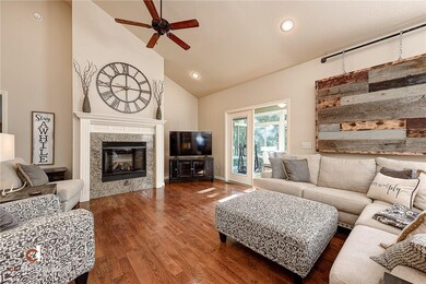 Living room with gas busing fireplace