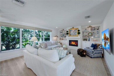 Living room with light hardwood / wood-style floor
