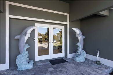 Property entrance featuring french doors and stucc