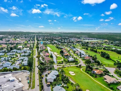Aerial view featuring view of golf course and a re