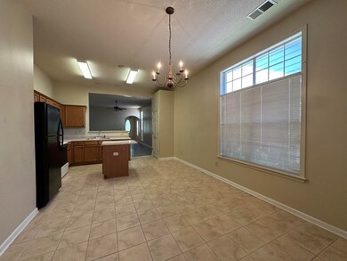 Kitchen featuring decorative light fixtures, black
