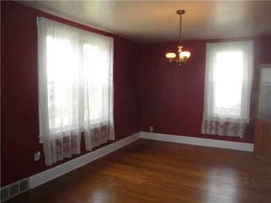 Dining Room. Accented by original glass fixture th