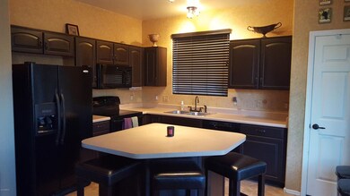 Kitchen features refurbished cabinets