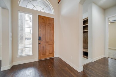 From this view of the front entry, you can see the built-in lockers in the mudroom leading to the garage and the office that's tucked away from the rest of the house allowing for a quiet work-form-home space.