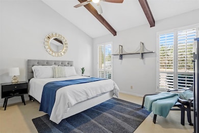Carpeted bedroom featuring baseboards, a ceiling 