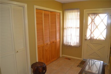 Entry of home with 3 large closets