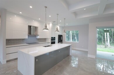 Kitchen featuring black electric stovetop, wall ch