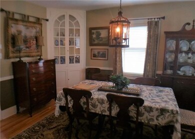 Dining Room has beautiful hardwood floors and buil