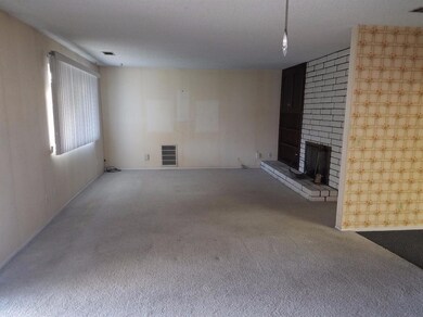 The spacious 13 ft by 17 ft living room