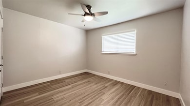 Unfurnished room with light wood-style flooring, 