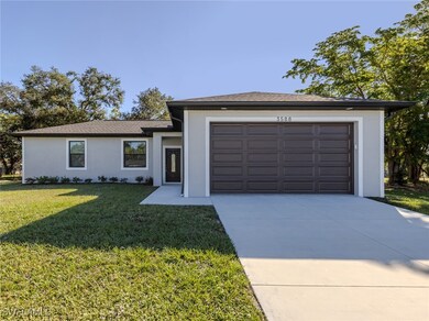Ranch-style house with stucco siding, a front lawn
