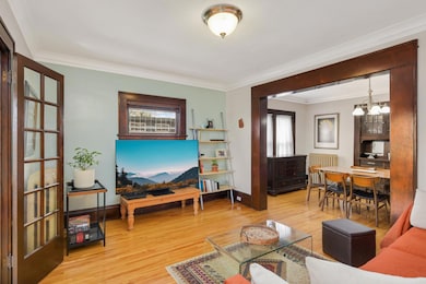 The original leaded window is a lovely focal point in the main living space.