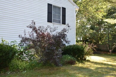 Side of house with view of back yard