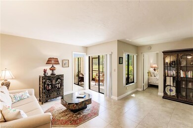 Living room with light tile patterned floors