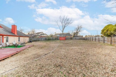 View of yard with a deck and a fenced backyard
