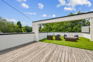 Private Rooftop Oasis is an entertainer's dream complete with Skyline Views, Multiple Lounge Areas, Turf Lawn, and plenty of space for Outdoor Dining, Grilling, or even a future Hot Tub or Expansion.