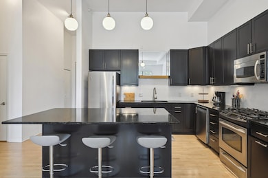 Center island kitchen with stainless appliances