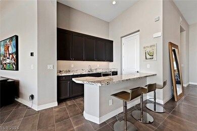 Bar with pantry, sink and wine refrigerator