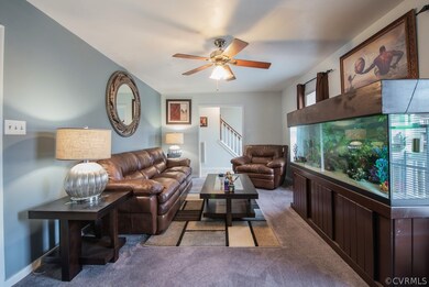 Additional view of family room depicting the foyer