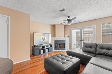 Living room with light wood finished floors, a ce