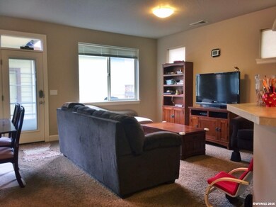 Living room facing rear and garage