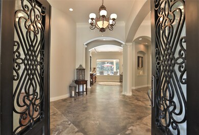 Enter into the large foyer and your eyes will immediately take you to the large window with views of the pool area. Recent interior paint throughout the house.