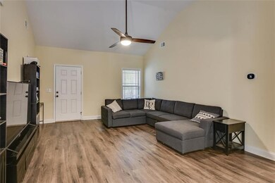 Living room with high vaulted ceiling, wood finish