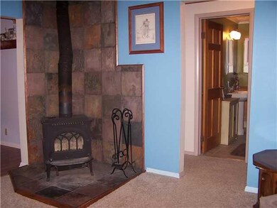Living Room. Wood Stove has a lovely tiled hearth.