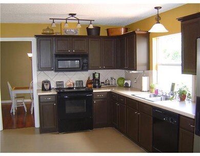 Kitchen. Nicely appointed eat-kitchen with black a