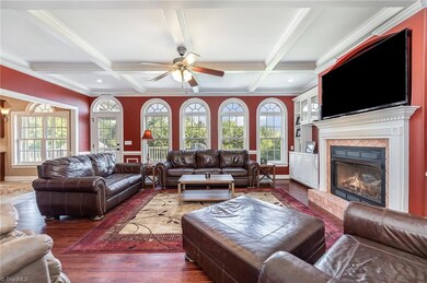 A view into the Great Room from the Living Room.  Fantastic Natural Light and easy Access to the Deck and Screened Porch.