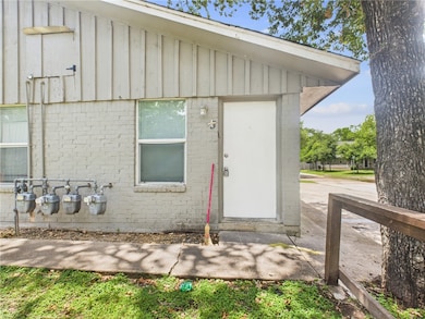 Entrance to property featuring board and batten si
